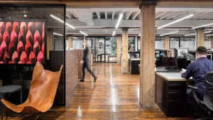 L’Oréal office in West Chelsea with linear lighting integrated throughout the open workplace.