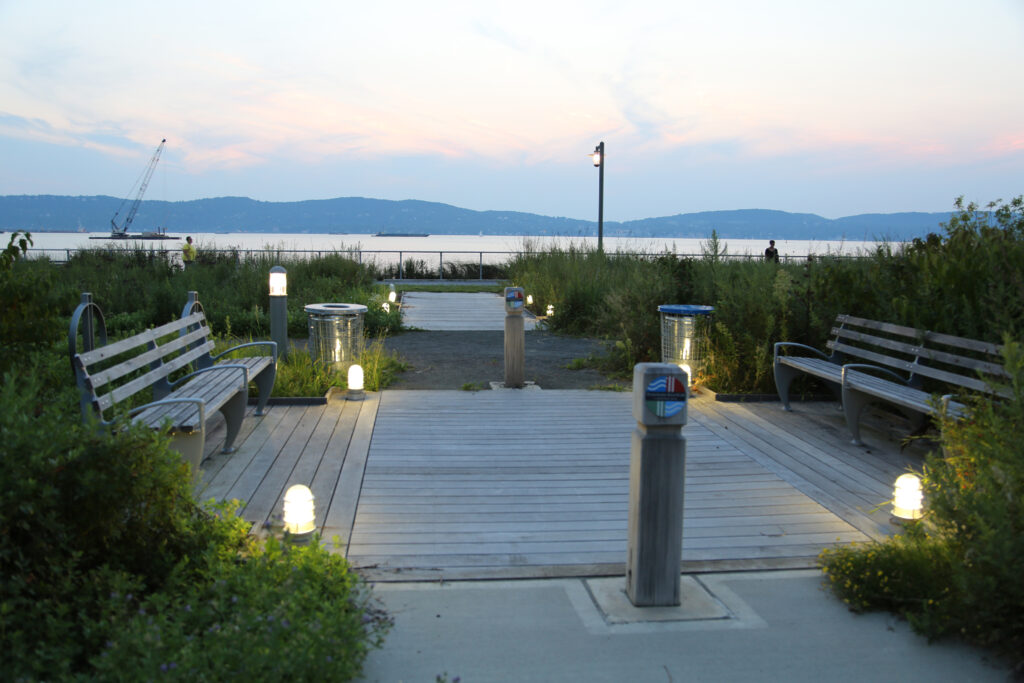 Low level lighting illuminating a waterfront seating area at Hudson RiverWalk Park at Tarrytown.