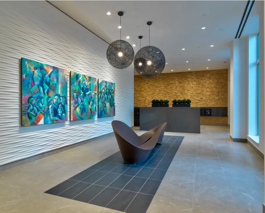 Lobby with upscale multifamily lighting design.