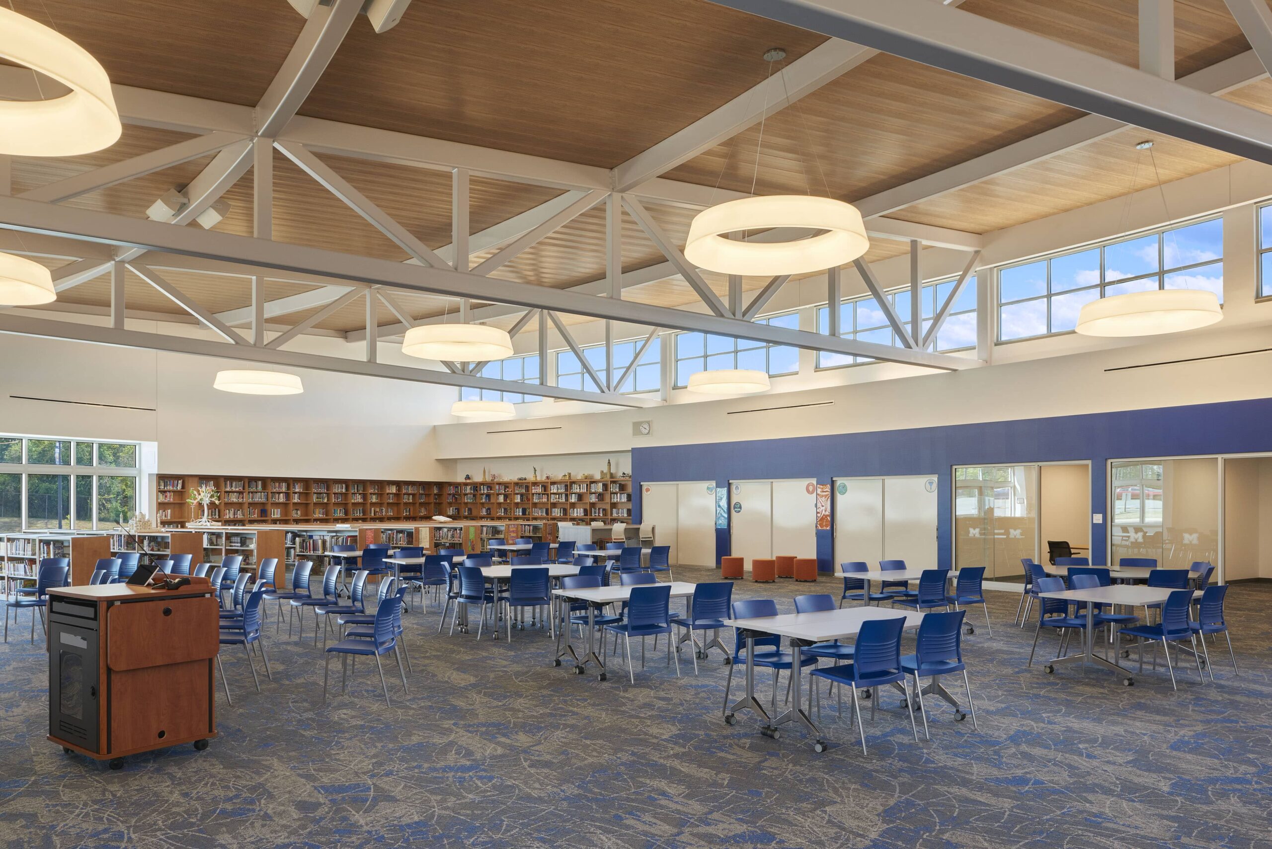 Middle School lighting project with engaging circular lighting features over desks and tables.