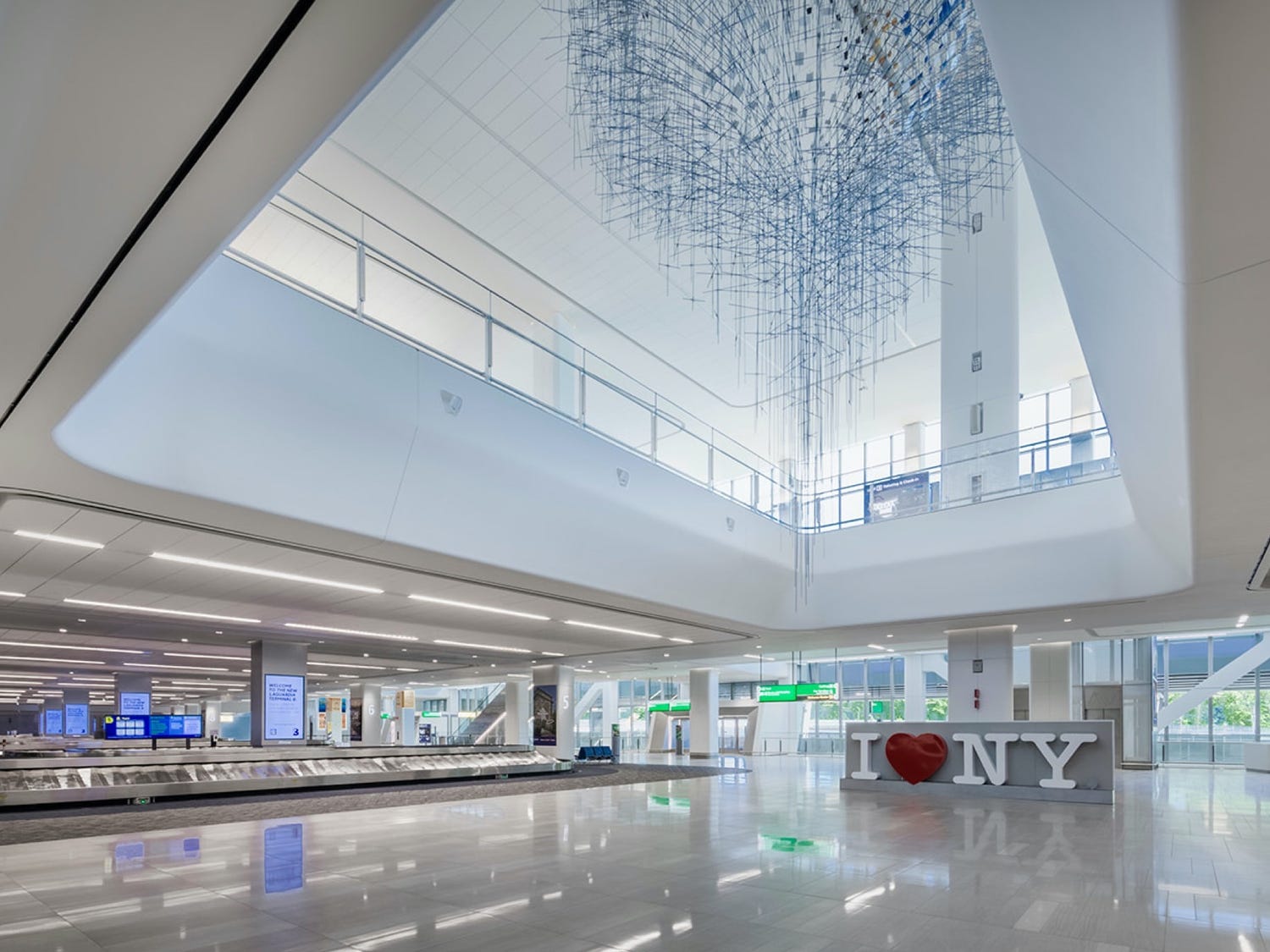 LaGuardia Airport Terminal B baggage claim, part of the terminal project for which Goldstick Studio provided lighting engineering services.