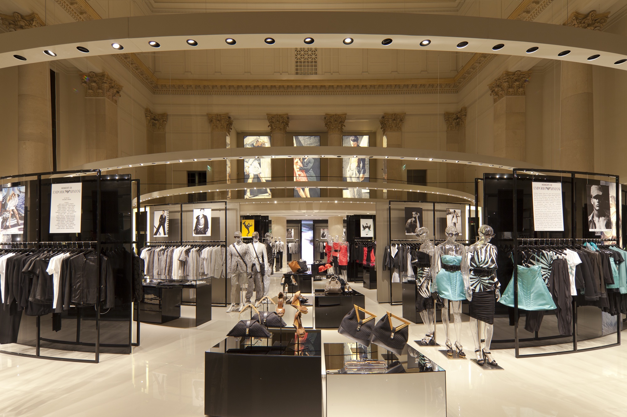 Emporio Armani flagship store with custom suspended retail lighting beneath the historic banking hall ceiling.