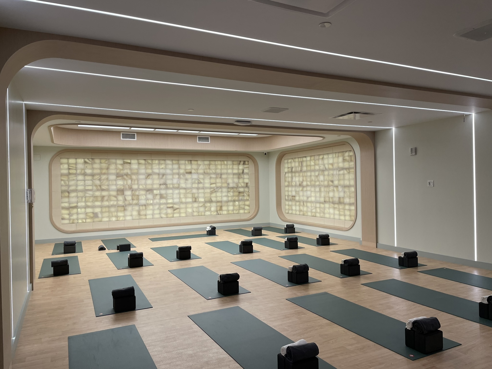 Chelsea Piers Fitness yoga studio with integrated linear and indirect lighting