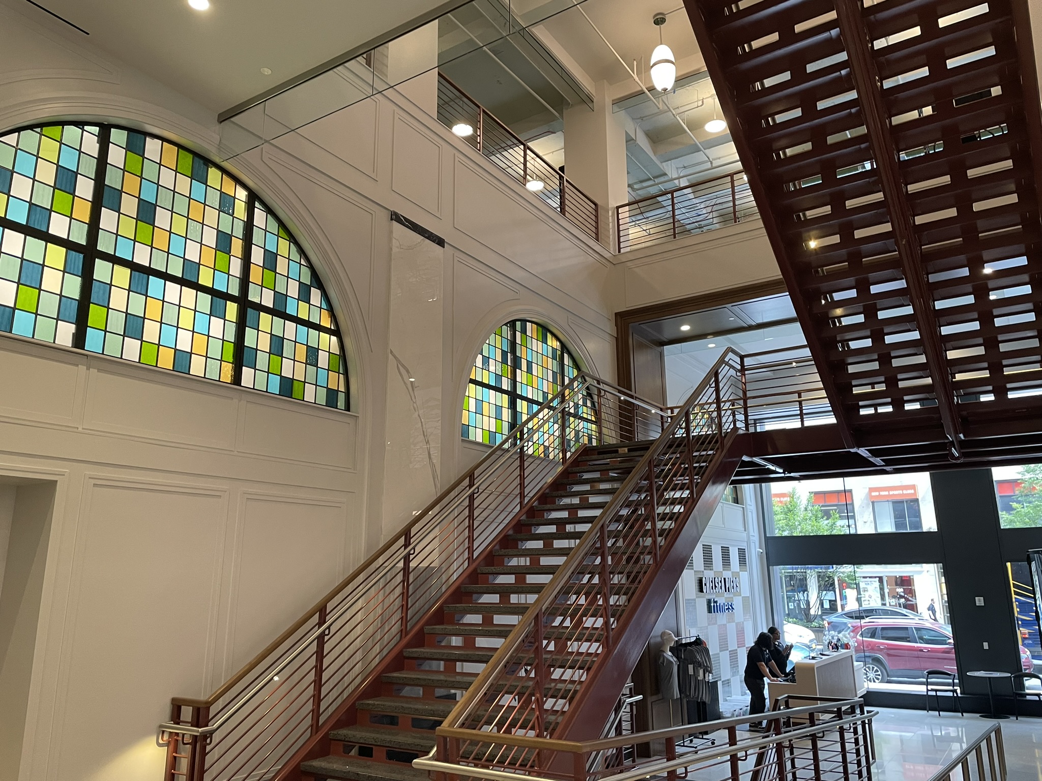 Chelsea Piers Fitness One Madison stair with stained glass windows and custom decorative lighting