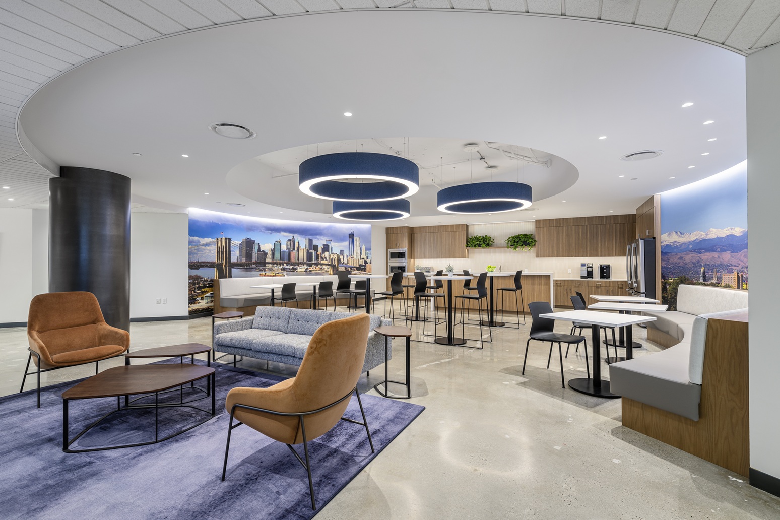 Modern office pantry and collaboration space with decorative lighting