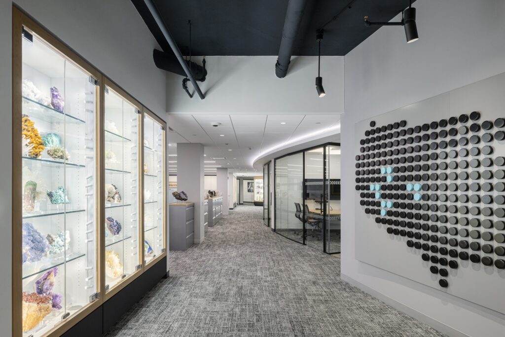 Illuminated geode display cabinets in MAXX Properties office