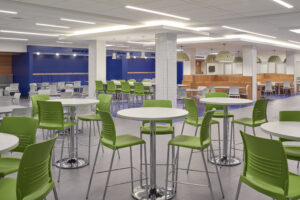 Middletown High School student café with linear architectural lighting and decorative pendant fixtures.
