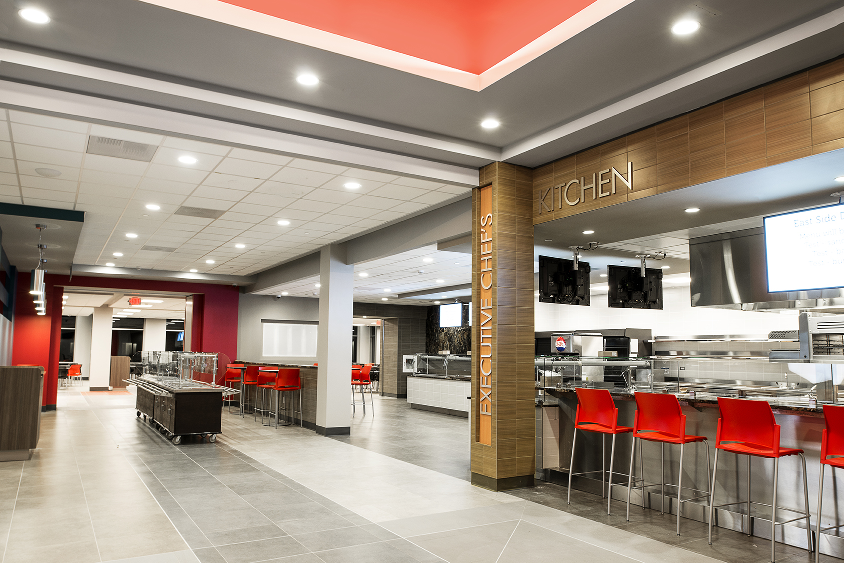 East Side Dining food service area with architectural lighting defining individual dining stations and seating.