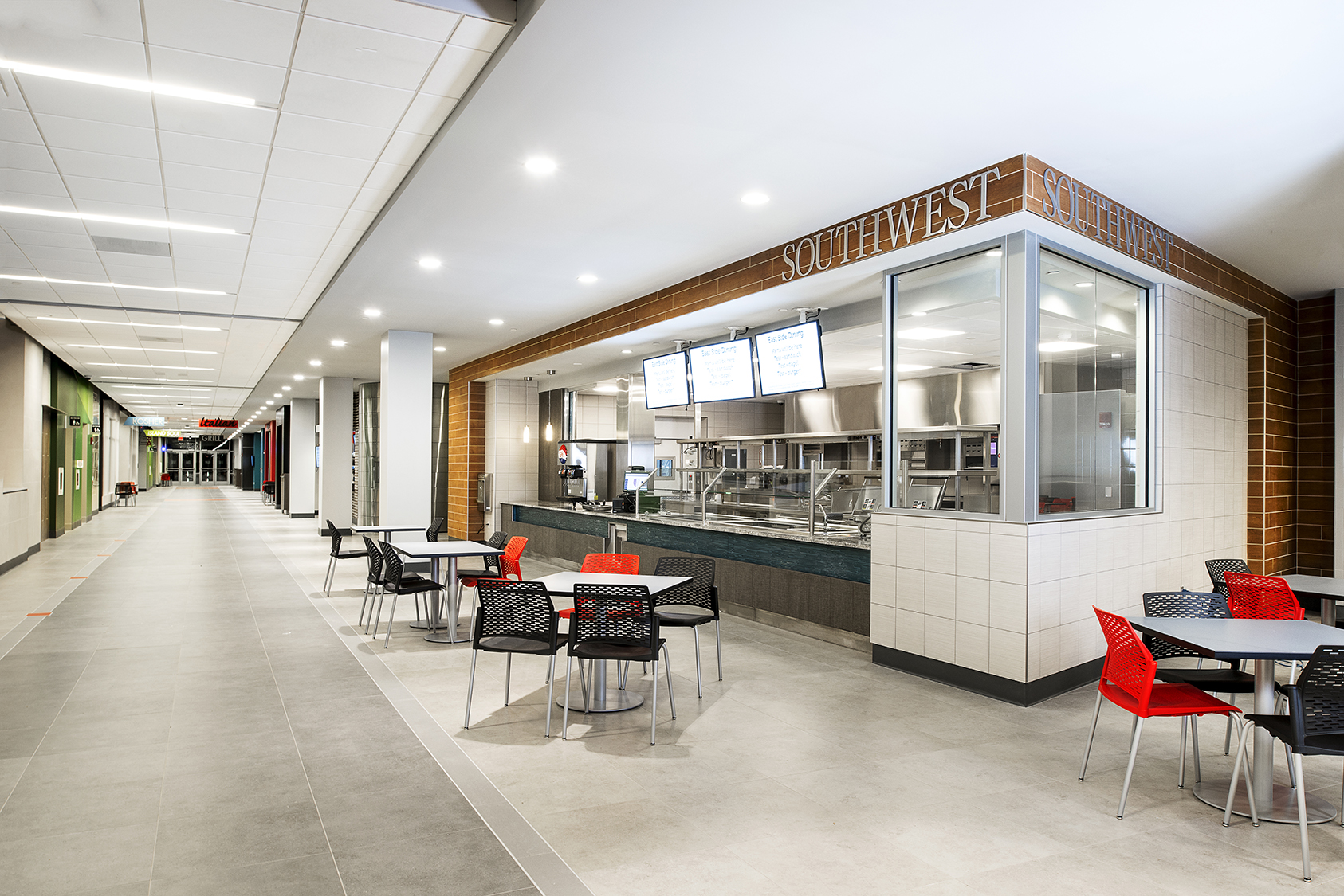 SUNY Stony Brook University East Side Dining with integrated linear lighting connecting dining, circulation, and food service areas.